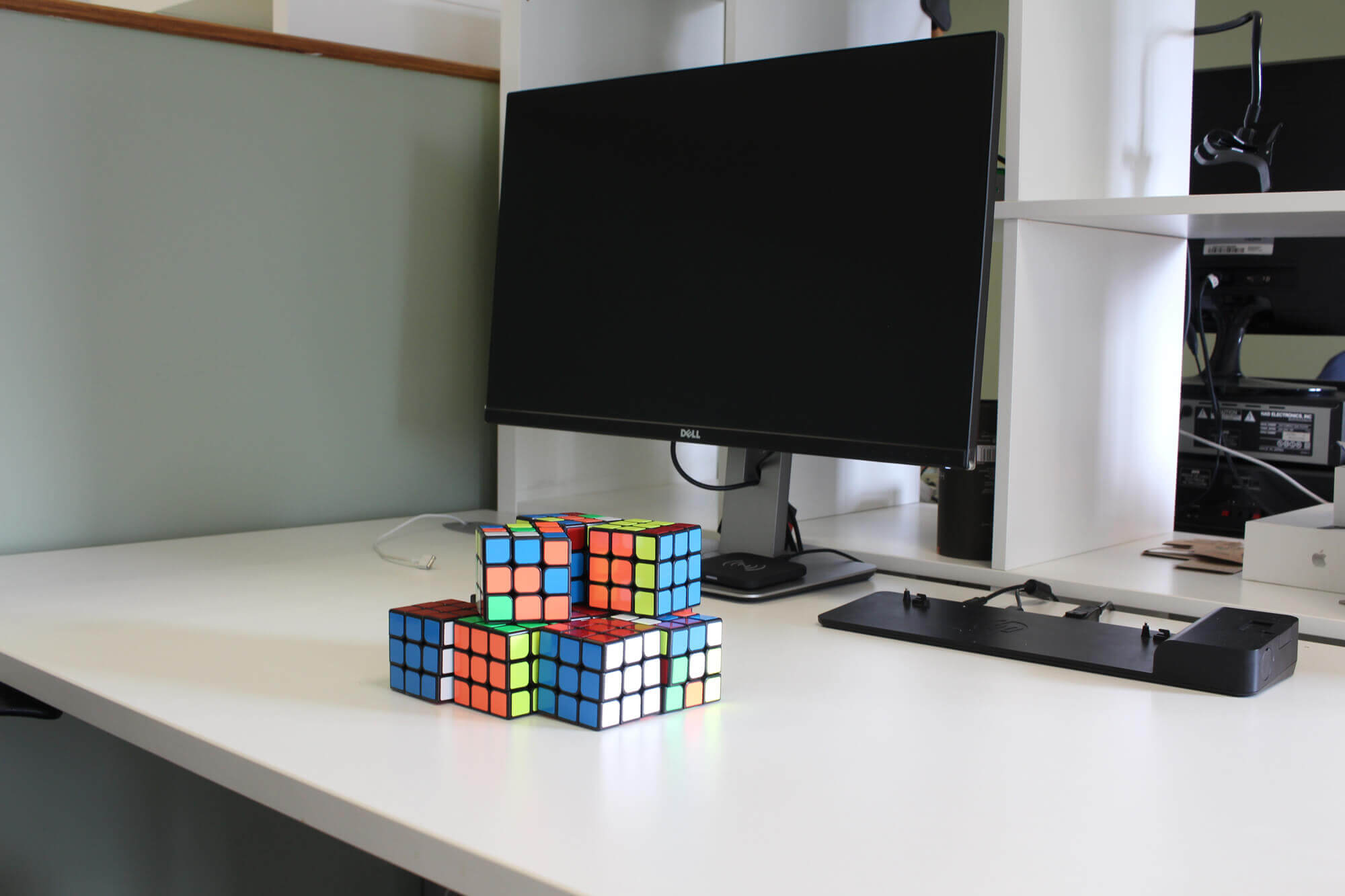 rubiks cubes on desk