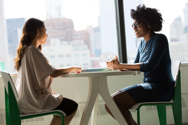 couple chatting at desk